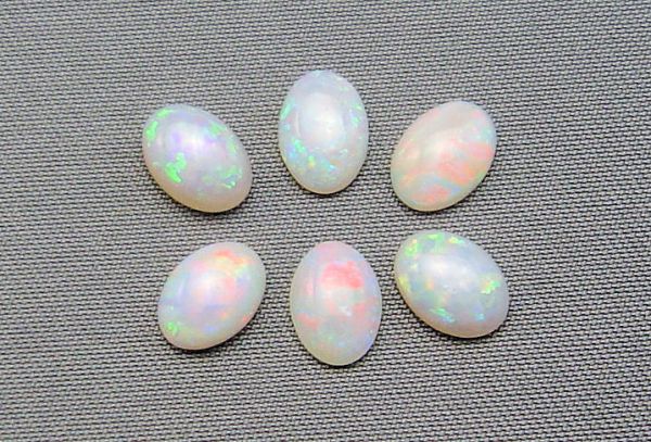 Opal Grey Base Oval Cxabochons @ $20.00/ct. - 5x7mm