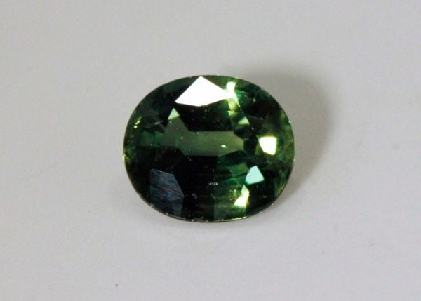 Green Sapphire Faceted Oval, 1.33 cts. - 6.1x7.1mm